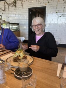 Mary enjoying her meal at the Wildseed Cafe